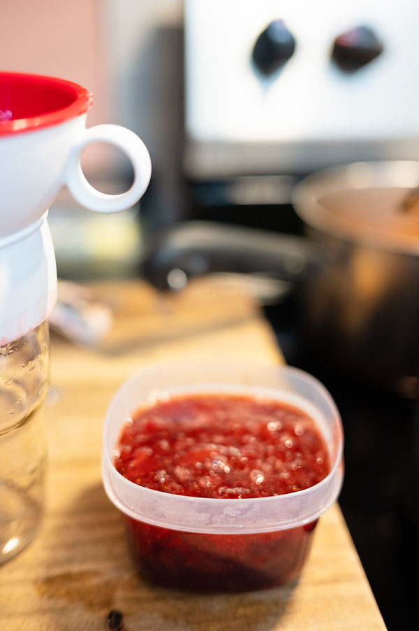 jam ladled into freezer containers