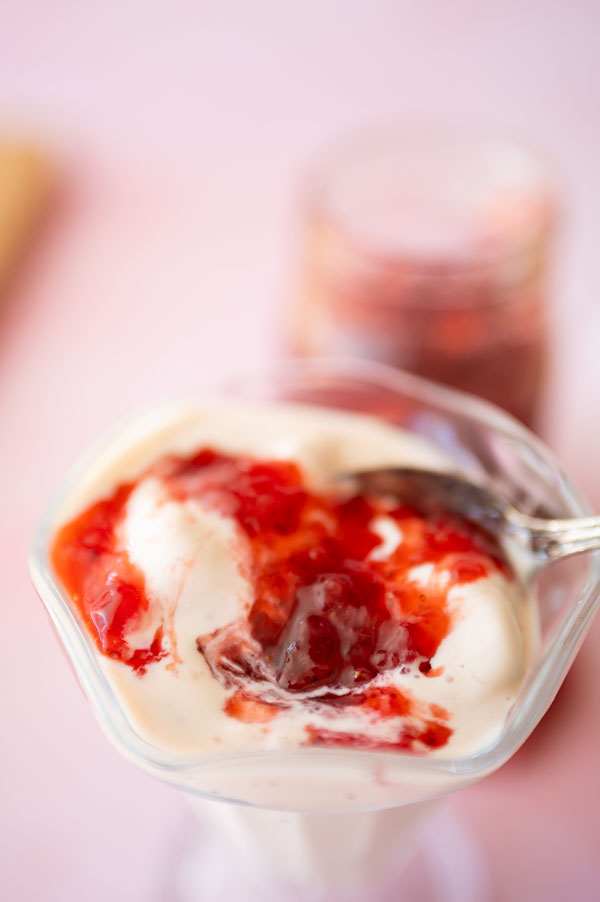 vanilla ice cream topped with fresh strawberry jam