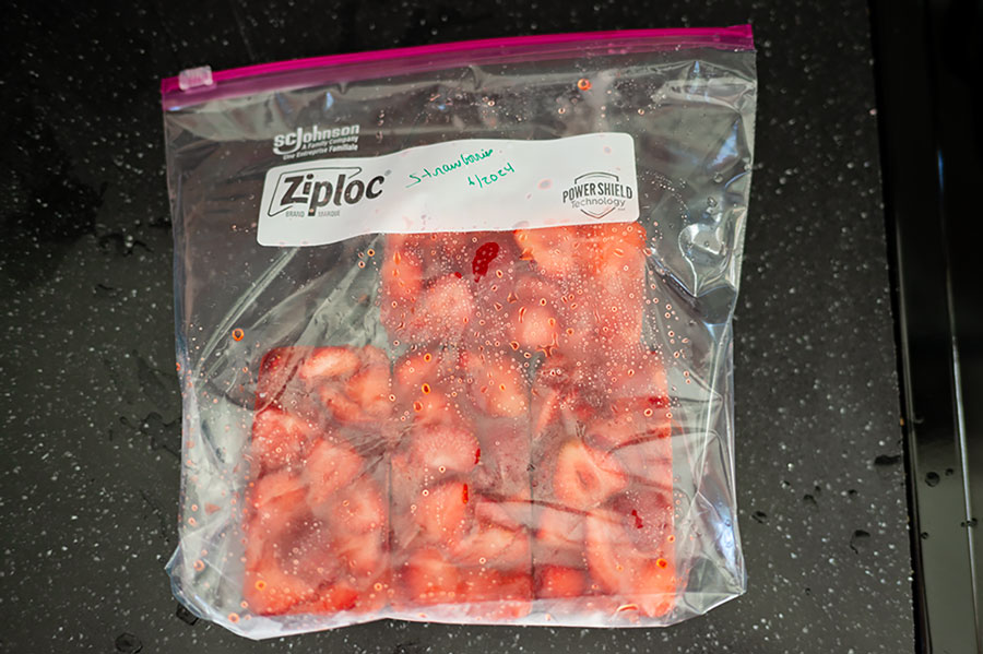 frozen blocks of strawberries removed for the molds and placed into freezer bags for storage